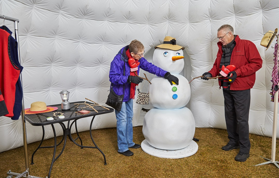 Build your own snowman mall holiday display with a foam snowman and props